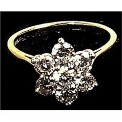 An 18ct gold flower cluster ring, set with brilliant cut diamonds, weighing approximately 1.50ct...