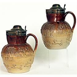 A pair of Staffordshire salt glazed stoneware hunting jugs, mid 19th Century, applied tavern scen...