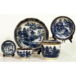 A Caughley blue and white pierced egg separator, circa 1785, printed with the Fisherman pattern w...