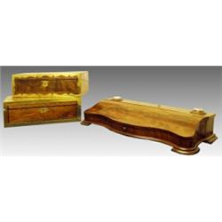 A late Victorian walnut and brass bound writing slope, circa 1890, the hinged rectangular lid wit...