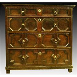 A William III oak chest, circa 1700, the planked rectangular top above four graduated geometric m...