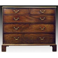 A George III mahogany chest, circa 1785, the concave moulded top above two short and three long g...