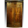 Image 1 : A George III mahogany and crossbanded bow front hanging corner cupboard, with twin hinged doors e...