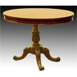 A mid Victorian mahogany oval table, circa 1860, the moulded top on a tapered cluster central sup...