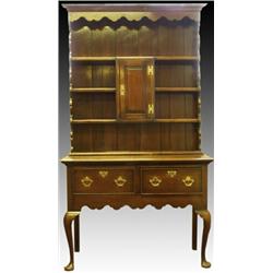 A George III and later oak dresser, of narrow proportions, the concave cornice and plate rack wit...