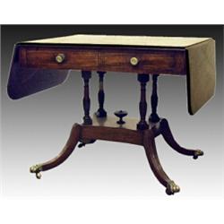 A George IV mahogany and crossbanded satinwood strung sofa table, the grooved rectangular top abo...