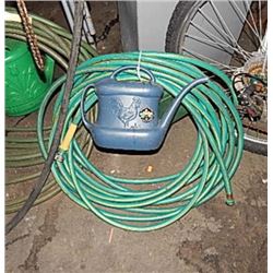 GARDEN HOSE AND 2 WATERING JUGS