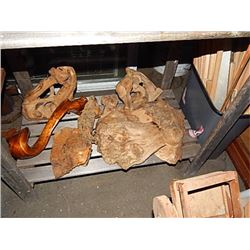 WEIRD AND FUNKY PIECES OF WOOD ON BOTTOM SHELF