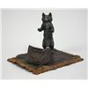 Image 1 : Bronze Cat standing on carpet  with bag