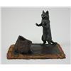 Image 2 : Bronze Cat standing on carpet  with bag