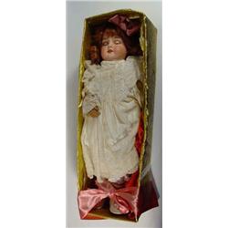 Armand Marseille porcelain headed doll with open mouth and closing eyes in a floral lace dress, 5…