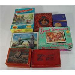 Large quantity of boxed wooden and cardboard jigsaws…