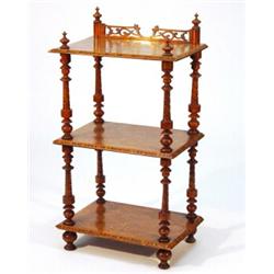 Victorian inlaid walnut three tier whatnot, the top tier with fretwork backrail on turned support…