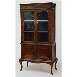 1920s oak bookcase, fitted a pair of glazed doors enclosing two shelves above a pair of fielded p…