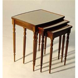 Nest of three inlaid mahogany tables on reeded legs…