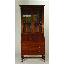 Good quality oak bureau bookcase, the moulded top above a pair of lozenge glazed doors enclosing…