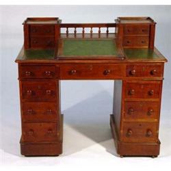 Victorian twin pedestal oak desk, fitted a centre slope flanked by a pair of small drawers on eit…