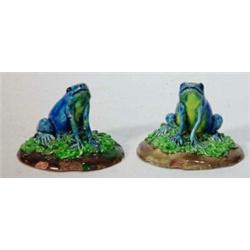 Two seated blue and yellow glazed Majolica frogs on green and brown bases, impressed marks to bas…