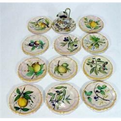 Eleven pottery Cantalani Majolica plates, hand painted with lemons, berries and grapes and a hand…