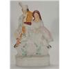 Image 1 : Hand painted Victorian Staffordshire figure group of a seated Scotsman and young maiden, 34cm hig…