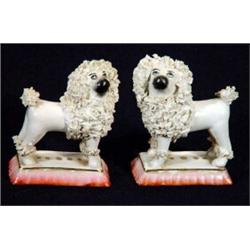 Pair of early 19th century porcelaineous standing Staffordshire poodles on pink bases, 7cm high…