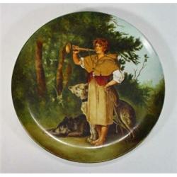 Victorian hand painted pottery plate decorated with a young Continental boy blowing a horn by wo…