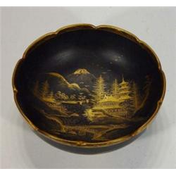 Satsuma black ground bowl, hand gilded with a landscape scene and floral panels, signature mark t…