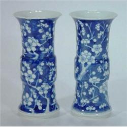 Pair of blue and white Chinese cylindrical vases decorated with prunus design, 22cm high, six fi…