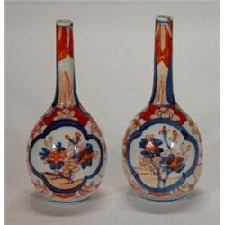 Pair of Japanese Imari bottle vases, hand painted with panels of flowers, 19cm high…