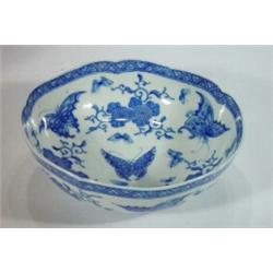 Shaped circular Chinese blue and white bowl, hand painted with blue butterflies and flowers, six…