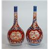 Image 1 : Pair of hand painted Japanese Imari bottle vases, decorated with panels of flowers, 20cm high…