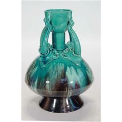 Large Christopher Dresser design blue and brown dripping glazed pottery vase, the handles formed…