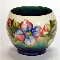 Hand painted Moorcroft floral vase on a white and blue background, 14cm high, marks to base…