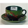 Image 1 : Moorcroft leaf and berry onto a green background patterned cup and saucer, W.M. and Moorcroft mar…