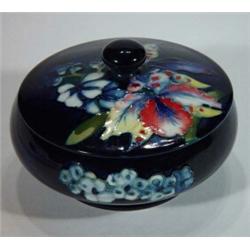 Circular Moorcroft trinket box and cover, hand painted with floral pattern, 12cm diameter, marks…