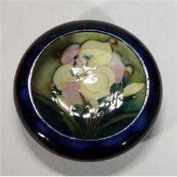 Circular Moorcroft floral decorated ashtray, various marks to base, 11cm diameter…