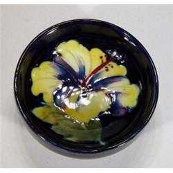 Small Moorcroft dish, decorated with a yellow frilled orchid, various marks to base, 8cm diameter…