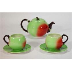 Hand painted Carltonware 'Apple' shaped Beatles teaset comprising teapot, two cups and saucers, d…