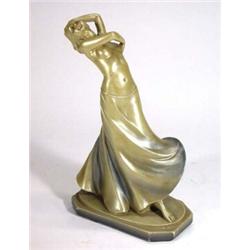 Gold painted plaster Art Deco maiden in a flowing skirt, initials and various marks to base, 32cm…