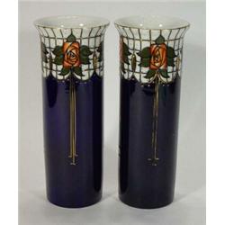 Pair of wood cylindrical 'Trellis' patterned vases, decorated with stylised roses on a cobalt blu…