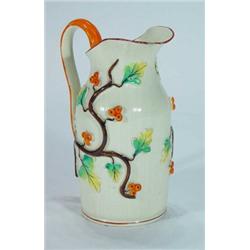 Relief moulded Victorian jug decorated with leaves and berries, impressed marks to base, 21cm hig…