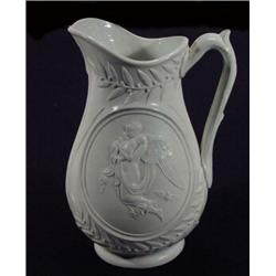 Victorian Parian jug decorated with leaves and berries and panels of winged maidens, 25cm high…