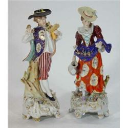 Pair of hand painted porcelain figurines of a lady with a watering can and a gentleman with a bou…