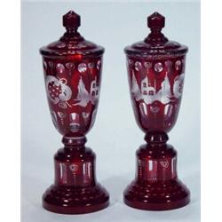 Pair of ruby flashed glass vases and covers decorated with birds and swags, etc, 25cm high…