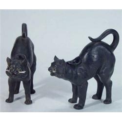 Pair of black glazed pottery scared cat candlesticks, 16cm high…