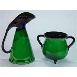 Green glazed Watcombe pottery Christopher Dresser style jug and twin handled cauldron, impressed…