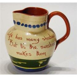 Mottoware jug, decorated with sailing barges, 'Life has many shadows ...', 14cm high…