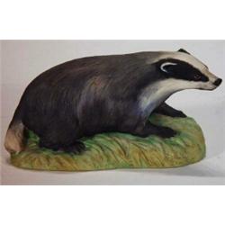 Hand painted Aynsley seated badger, 19cm in length…