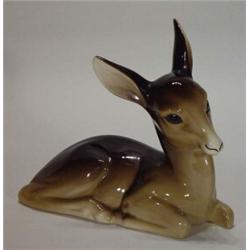 Hand painted Midwinter seated deer, 22cm in length…