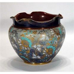 Doulton Lambeth jardiniere, hand enamelled with blue and white flowers on a blue and gilt ground,…